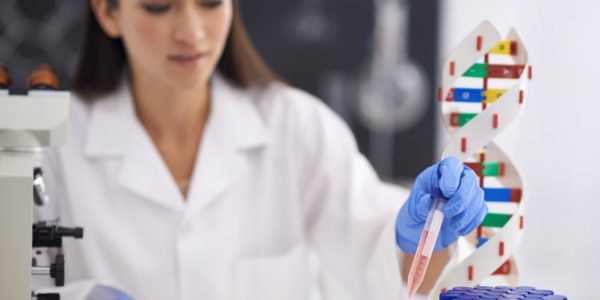 Genetics is her passion. Shot of a female scientist observing a sample in a test tube.